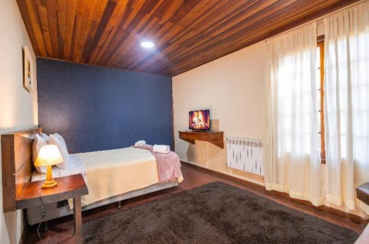 Cama ou camas em um quarto em Pousada Villa Serena