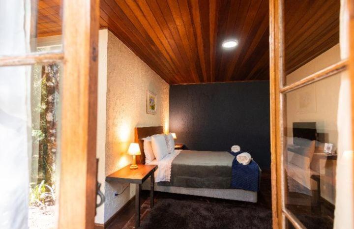Cama ou camas em um quarto em Pousada Villa Serena