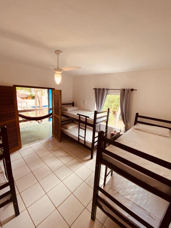 Postel nebo postele na pokoji v ubytování Adios Amigos Hostel