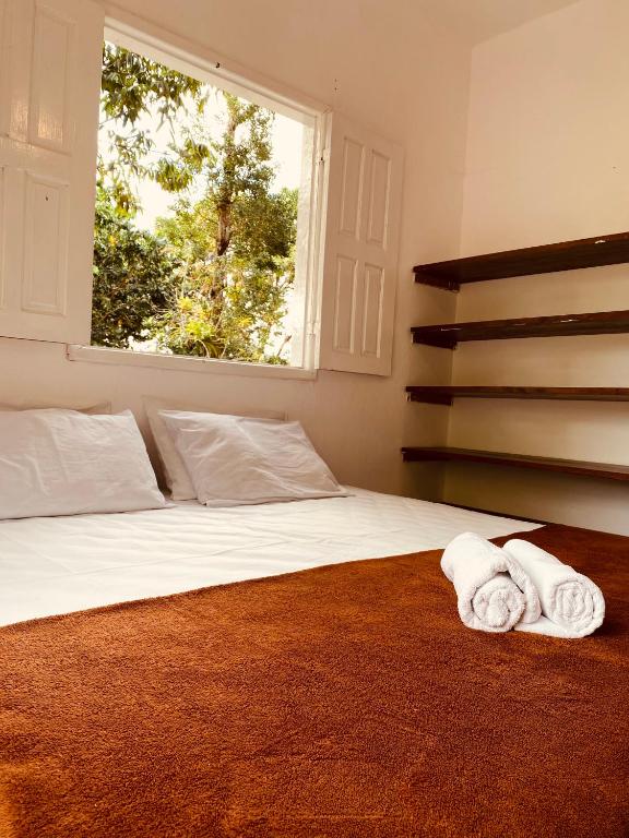 Postel nebo postele na pokoji v ubytování Adios Amigos Hostel