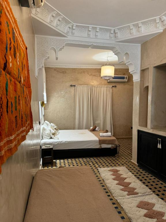 Postel nebo postele na pokoji v ubytování Riad dar serenity