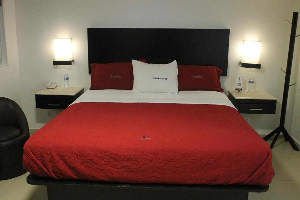 Postel nebo postele na pokoji v ubytování Hotel Velario