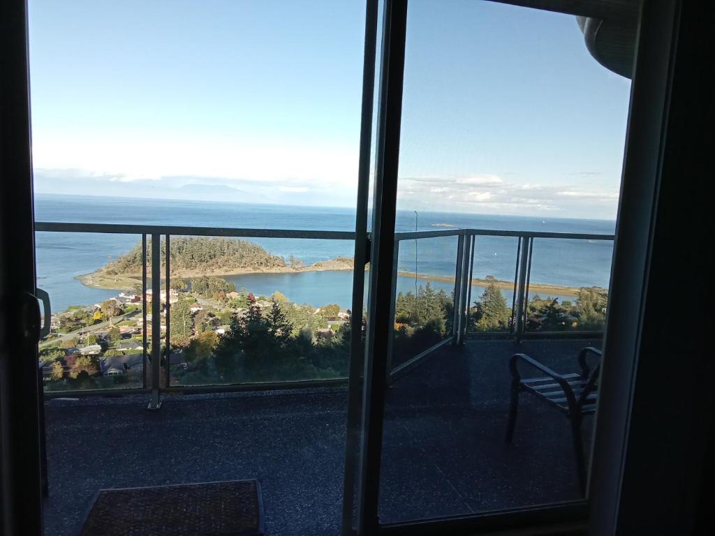 a view of the ocean from a room with a window at Gibralter Rock Ocean View B&B in Nanaimo