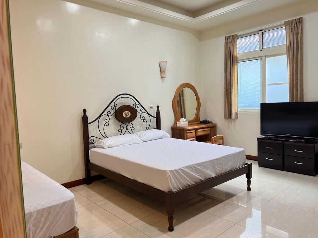 Postel nebo postele na pokoji v ubytování 天隆民宿Tian Long Tea Farm HomeStay