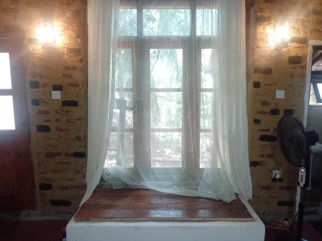 Postel nebo postele na pokoji v ubytování Kon Tree Shade
