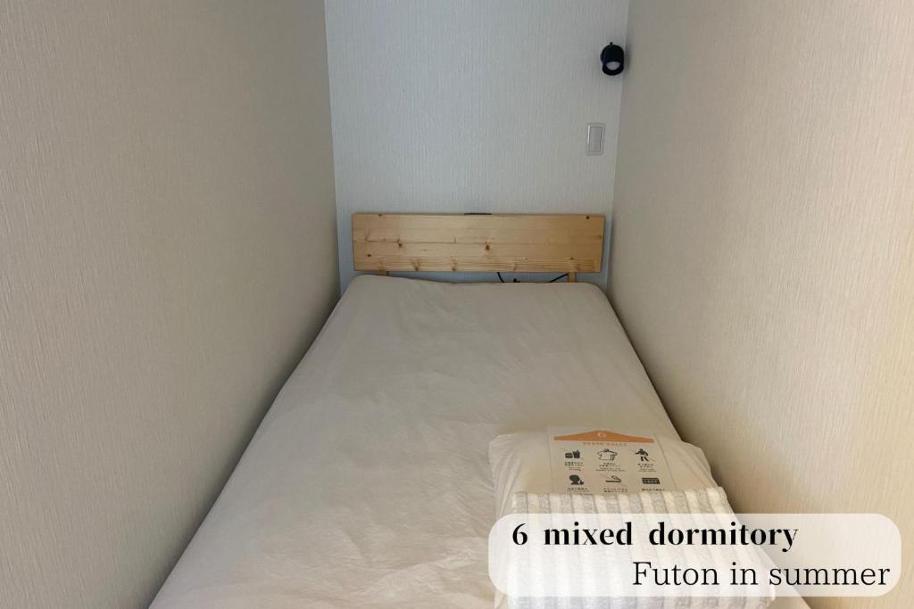 Postel nebo postele na pokoji v ubytování GUESTHOUSE富士と碧