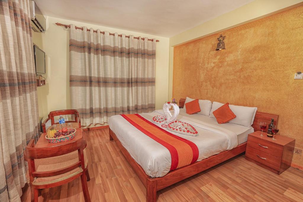 Postel nebo postele na pokoji v ubytování Royal Kings Hotel