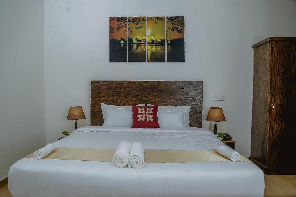 Postel nebo postele na pokoji v ubytování Lucky Transit Hotel - Katunayake Airport
