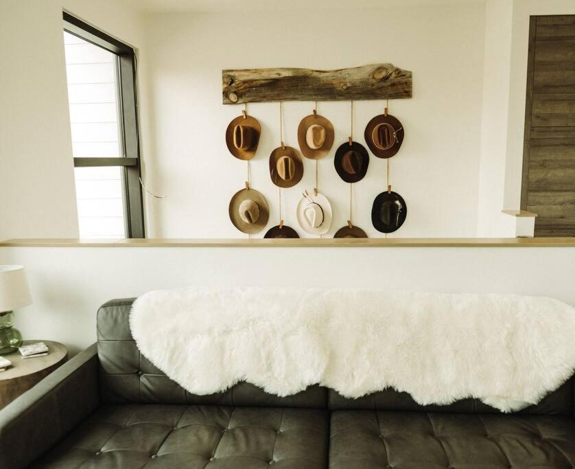 a living room with a couch and pots and pans at The Cowboy Inn - Luxury Bozeman in Bozeman