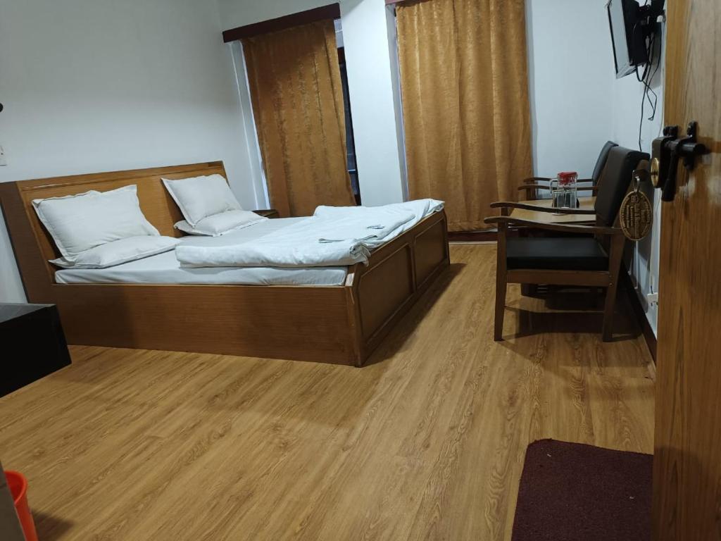 Postel nebo postele na pokoji v ubytování Hotel Ruby and Restaurant
