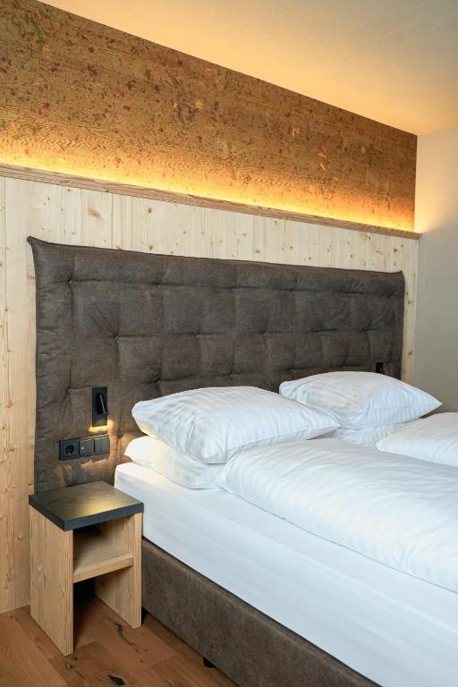 Postel nebo postele na pokoji v ubytování Hotel Pozzamanigoni
