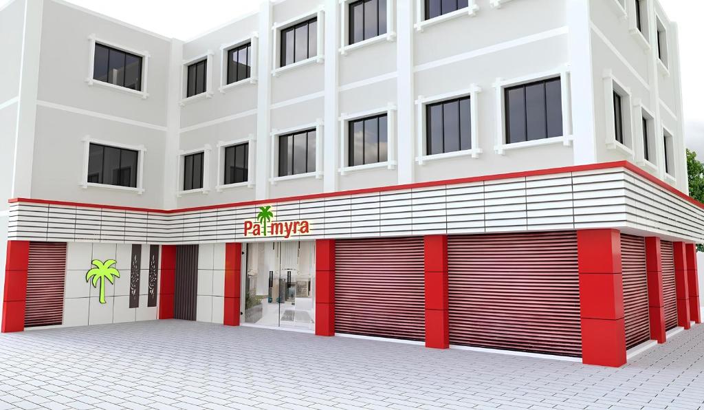 a rendering of a building with a parking garage at Hotel Palmyra Grand Inn in Tirunelveli