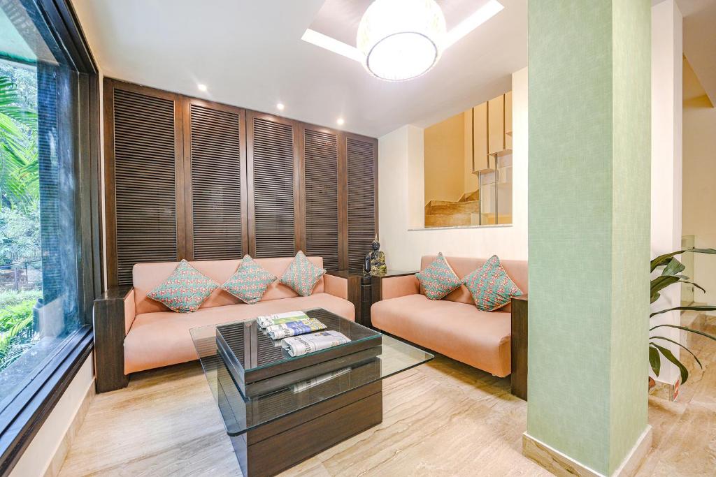Postel nebo postele na pokoji v ubytování FabHotel Aashraye