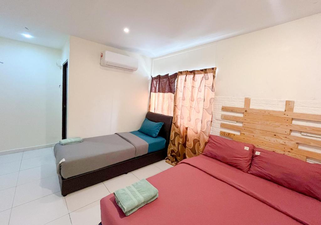 Postel nebo postele na pokoji v ubytování Hotel EC Double Star KLIA 1-KLIA 2