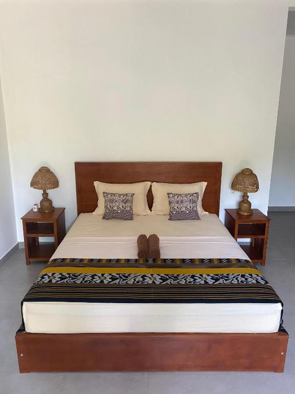 Postel nebo postele na pokoji v ubytování Cewin's Homestay