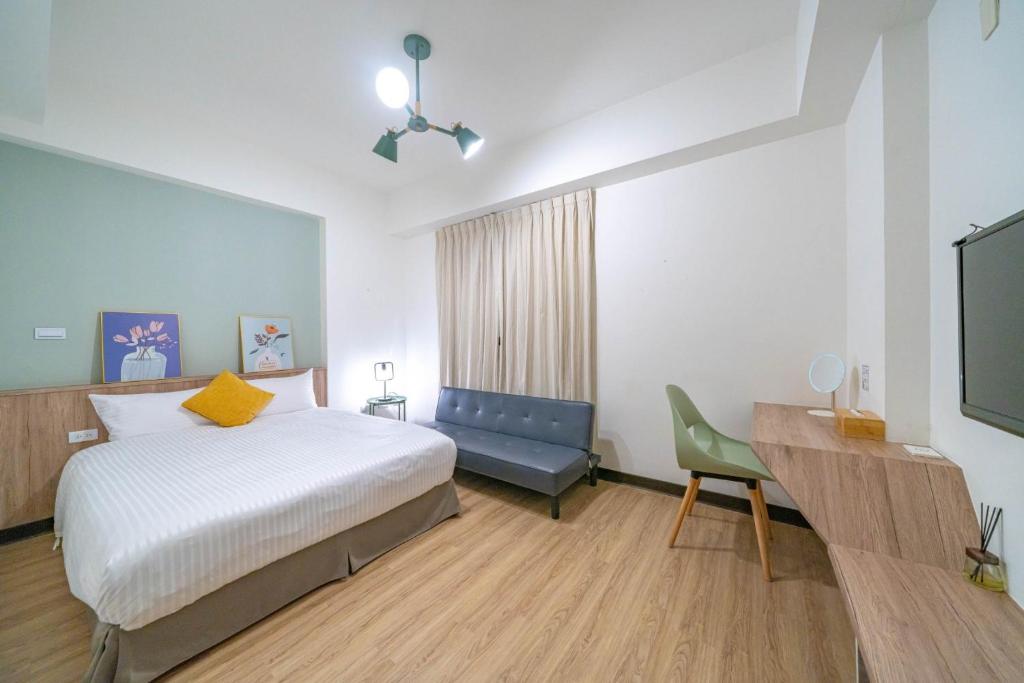 Park Oasis Tainan Villaにあるベッド