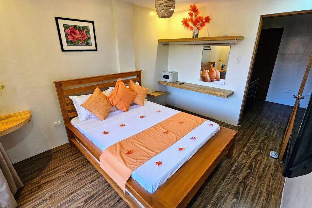 Postel nebo postele na pokoji v ubytování Villa Naranja Pagudpud - Biondo