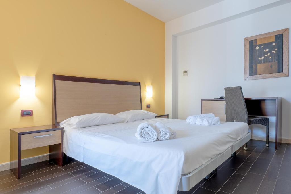 Postel nebo postele na pokoji v ubytování Nauticus Hotel Ugento