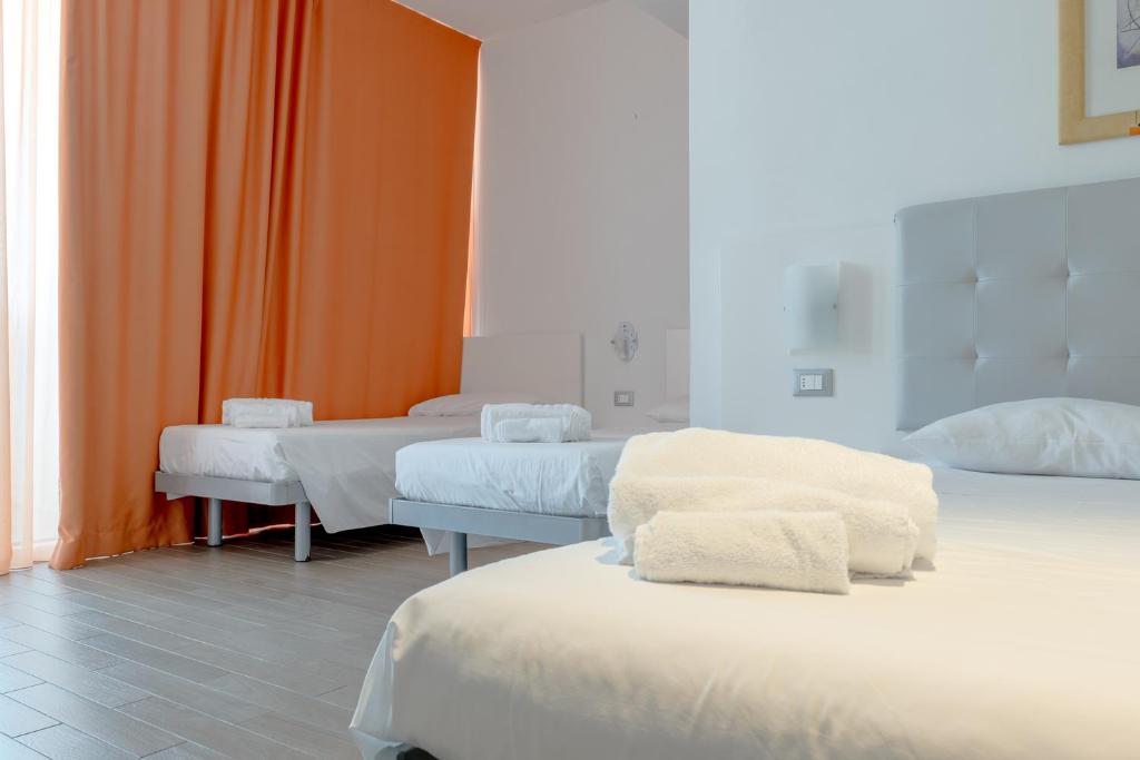 Postel nebo postele na pokoji v ubytování Nauticus Hotel Ugento