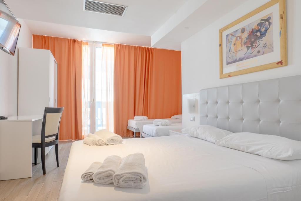 Postel nebo postele na pokoji v ubytování Nauticus Hotel Ugento