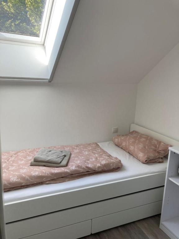 Postel nebo postele na pokoji v ubytování FeWo Lindenhof