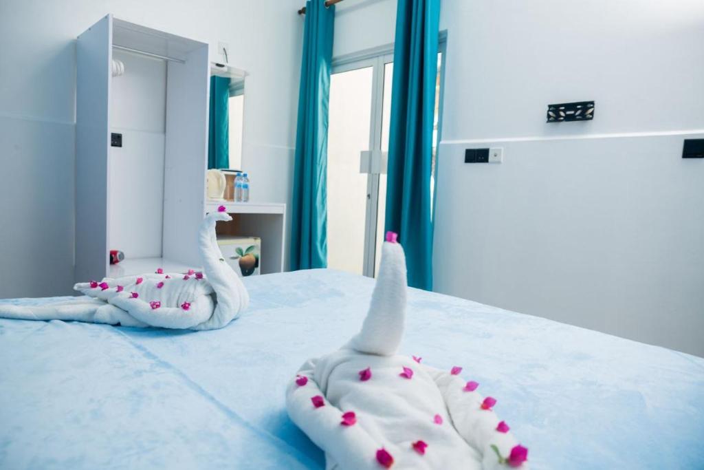 Postel nebo postele na pokoji v ubytování Ithaa Seaview