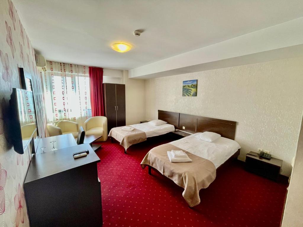 Postel nebo postele na pokoji v ubytování Hotel City