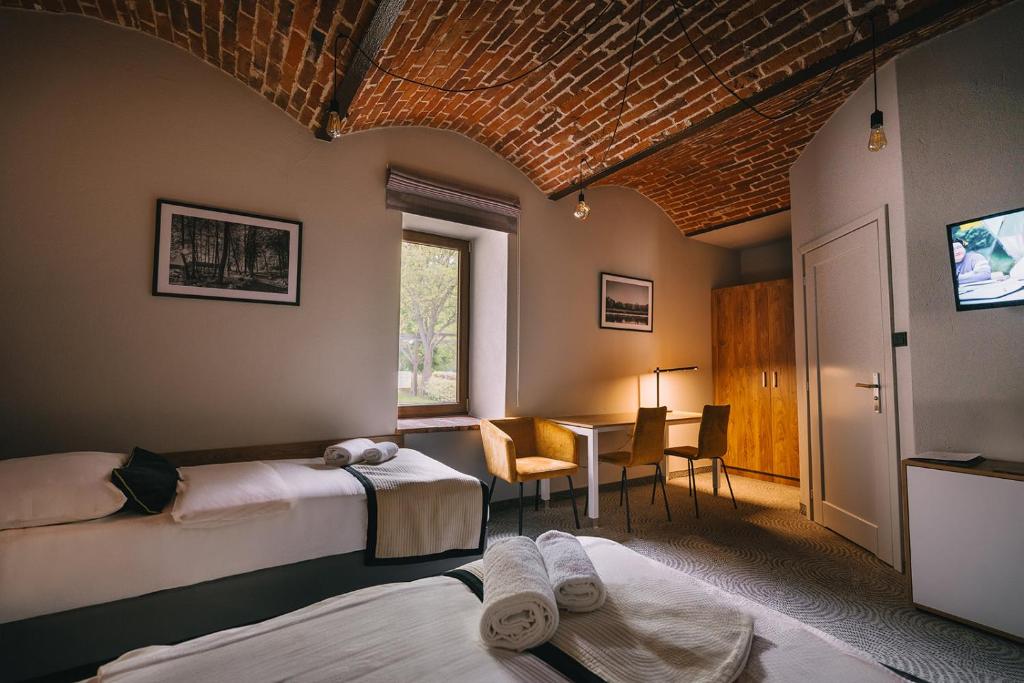 Postel nebo postele na pokoji v ubytování Dwór Kolesin