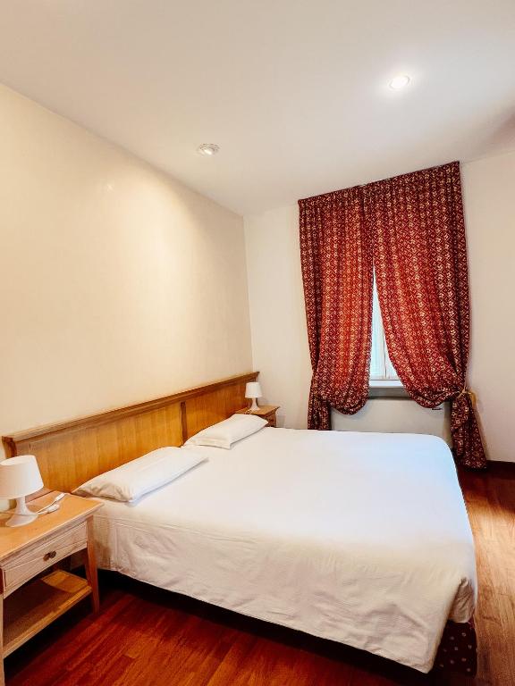 Postel nebo postele na pokoji v ubytování Gorizia Inn