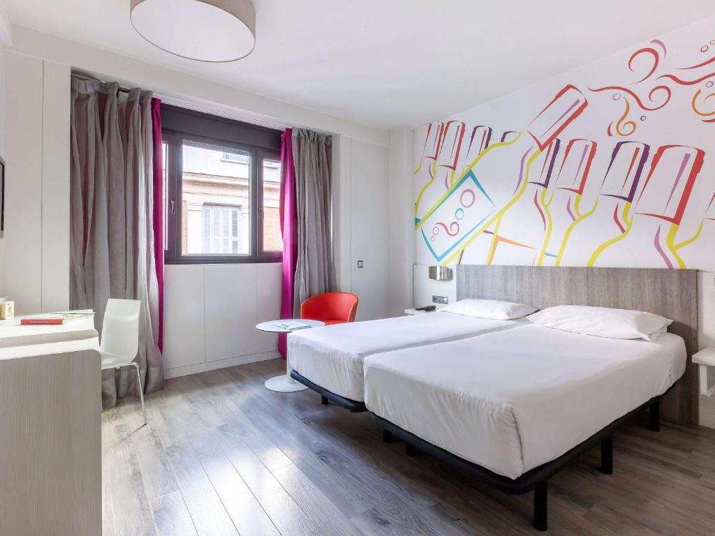 Posteľ alebo postele v izbe v ubytovaní Ibis Styles Madrid Prado