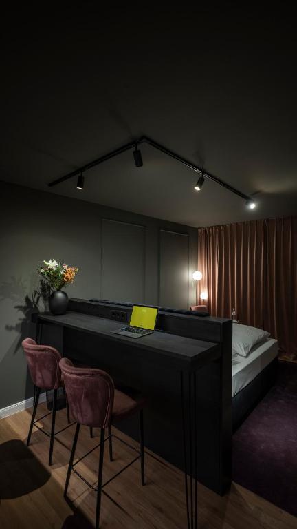 Postel nebo postele na pokoji v ubytování Leipzig Suites