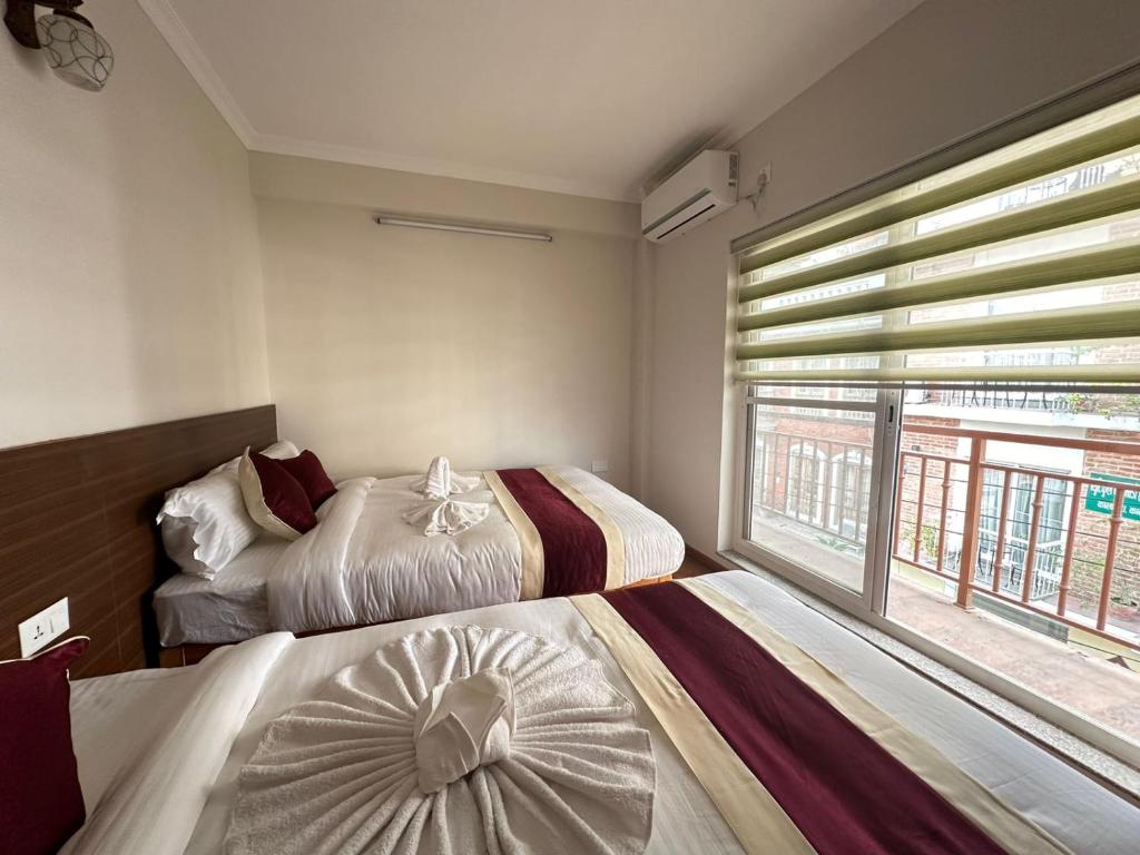 Postel nebo postele na pokoji v ubytování Hotel Sohum