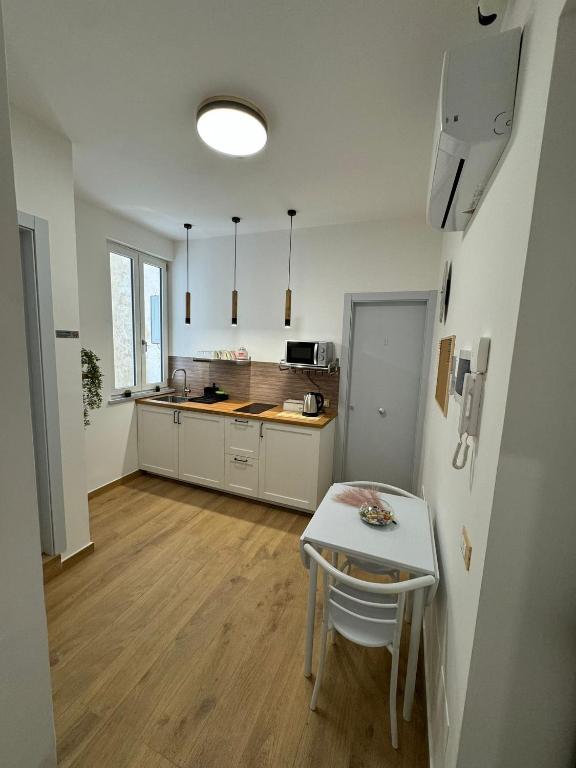 Kuchyň nebo kuchyňský kout v ubytování B&B Central Station