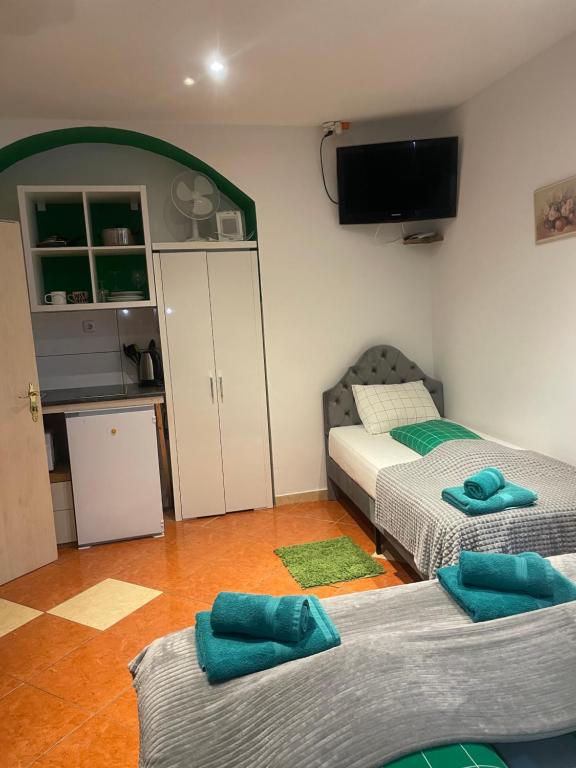 A bed or beds in a room at Viktoria ARTUR