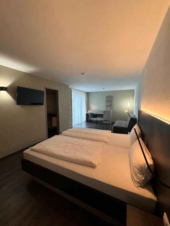 Postel nebo postele na pokoji v ubytování Hotel Feyrer