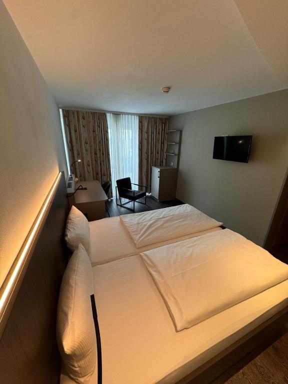 Postel nebo postele na pokoji v ubytování Hotel Feyrer