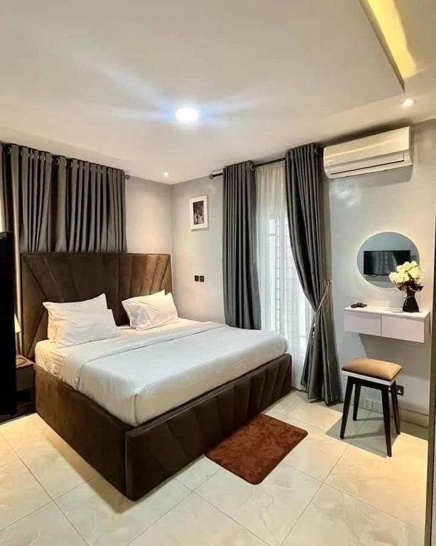 Postel nebo postele na pokoji v ubytování Keneuro hotel & suites