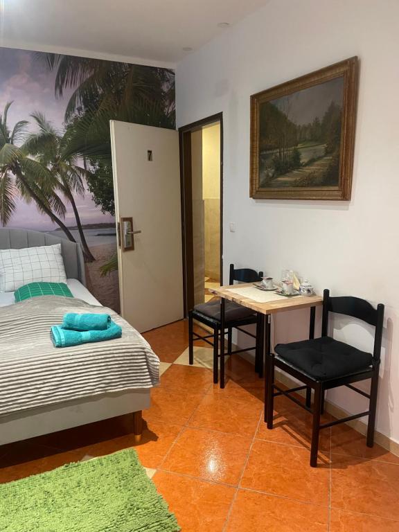 A bed or beds in a room at Viktoria ARTUR