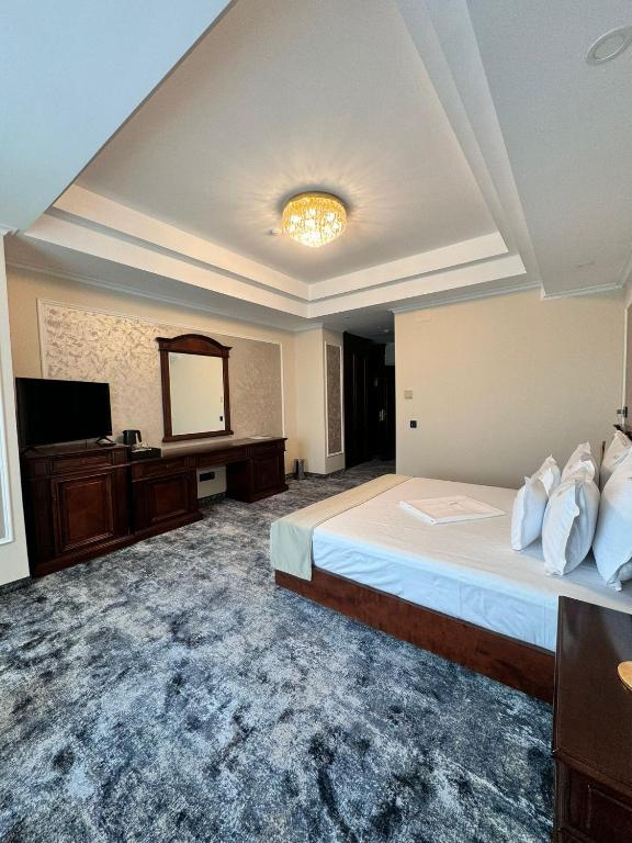 Postel nebo postele na pokoji v ubytování Hotel Bulevard