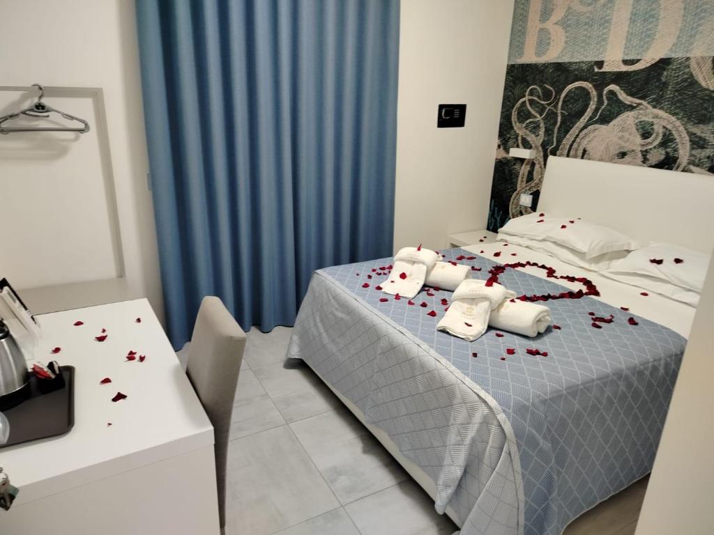 Łóżko lub łóżka w pokoju w obiekcie B&B Villa Fabrizia