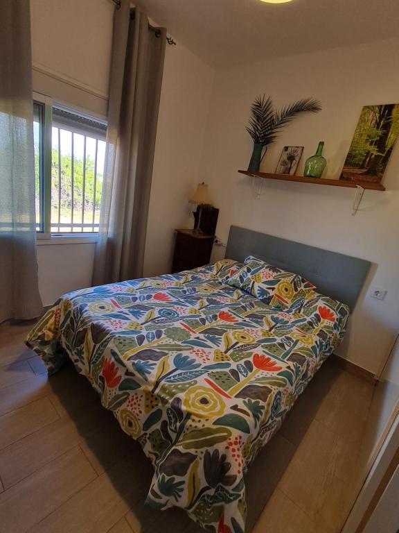 A bed or beds in a room at Villa Mirador del Sol, 45min playas de Doñana, 35min de Sevilla