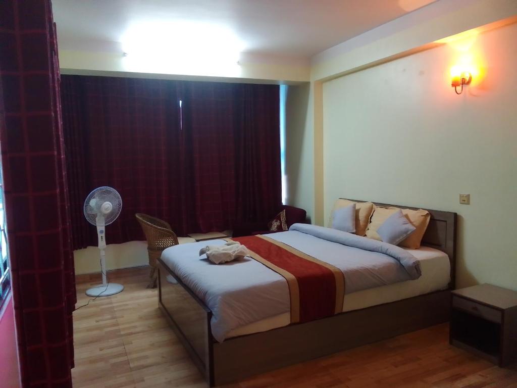 Postel nebo postele na pokoji v ubytování Hotel Pristine