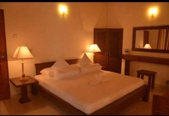 Postel nebo postele na pokoji v ubytování Kandy Highland Unique Hotel
