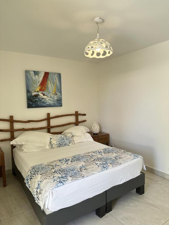 Postel nebo postele na pokoji v ubytování Majesty Palm Hôtel