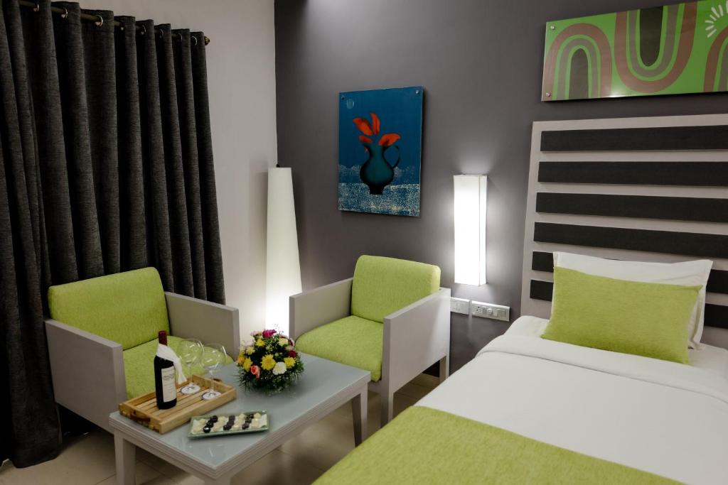 Postel nebo postele na pokoji v ubytování Regenta Baywatch Resort, Goa