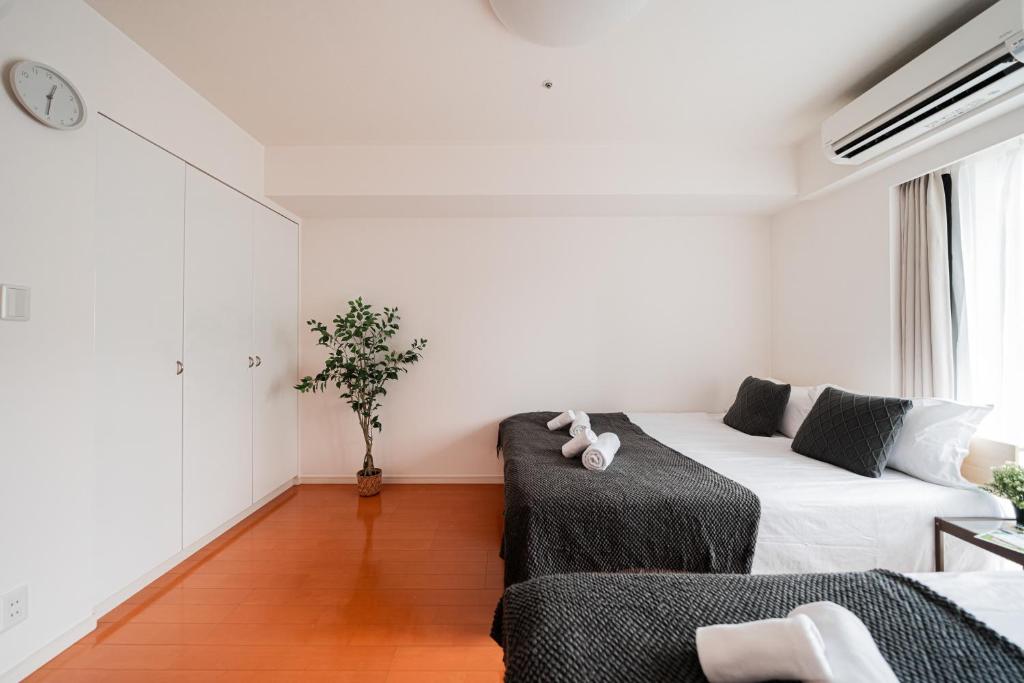 Shinjuku luxury Apart ment 2 minutes from Higashi-Shinjuku客房内的一张或多张床位