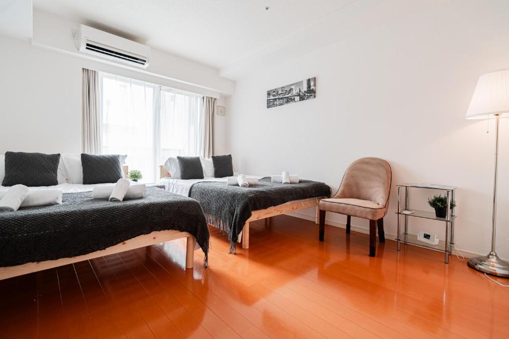 Shinjuku luxury Apart ment 2 minutes from Higashi-Shinjuku客房内的一张或多张床位