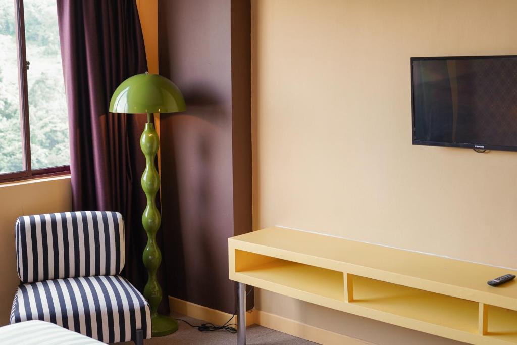 TV a/nebo společenská místnost v ubytování The Très Hotel