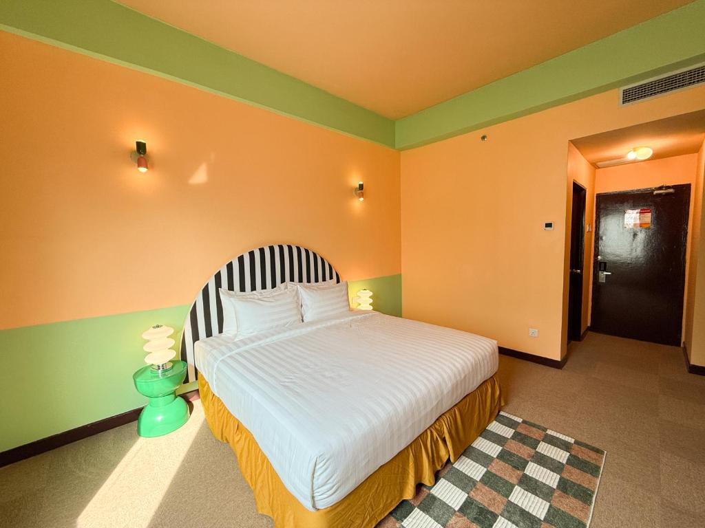 Postel nebo postele na pokoji v ubytování The Très Hotel