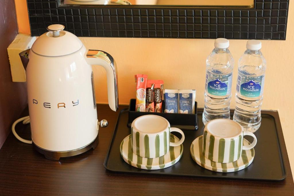 Příslušenství pro přípravu čaje a kávy v ubytování The Très Hotel